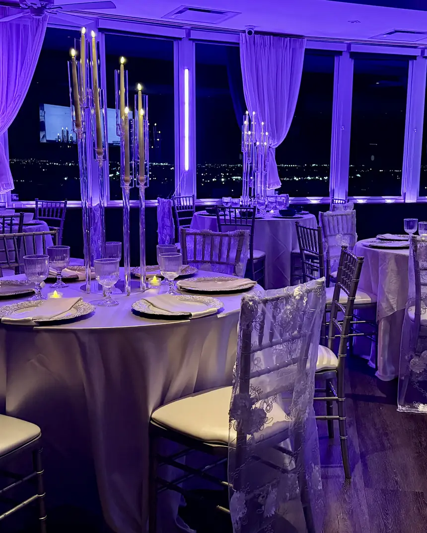 A room of candelabras at night width=